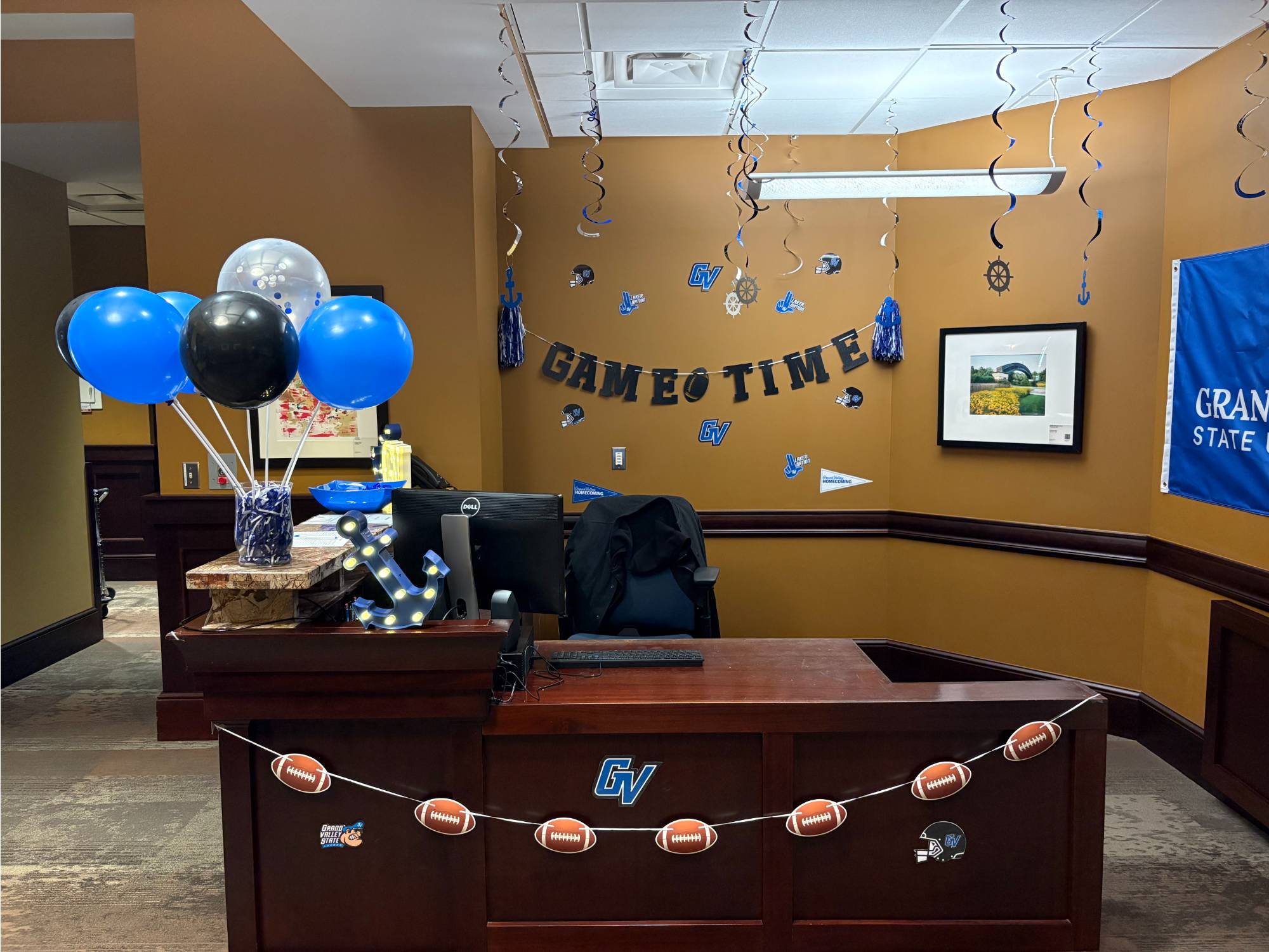 Detroit Center Homecoming office decorations, game time banner